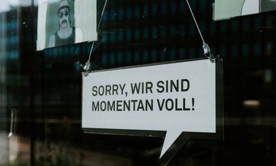 white and black wooden sign